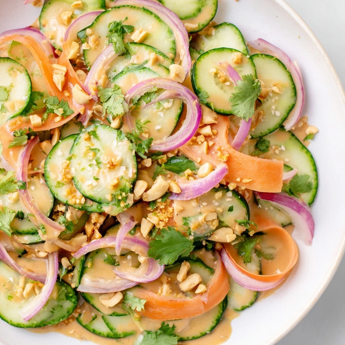 Fresh Thai-Style Peanut Cucumber Salad, vibrant with cilantro, ready for a cool, light lunch.