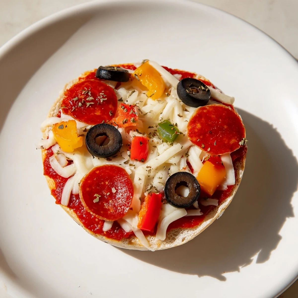 Freshly made mini bagel pizzas, featuring melted mozzarella, pepperoni, and a perfectly toasted bagel base.