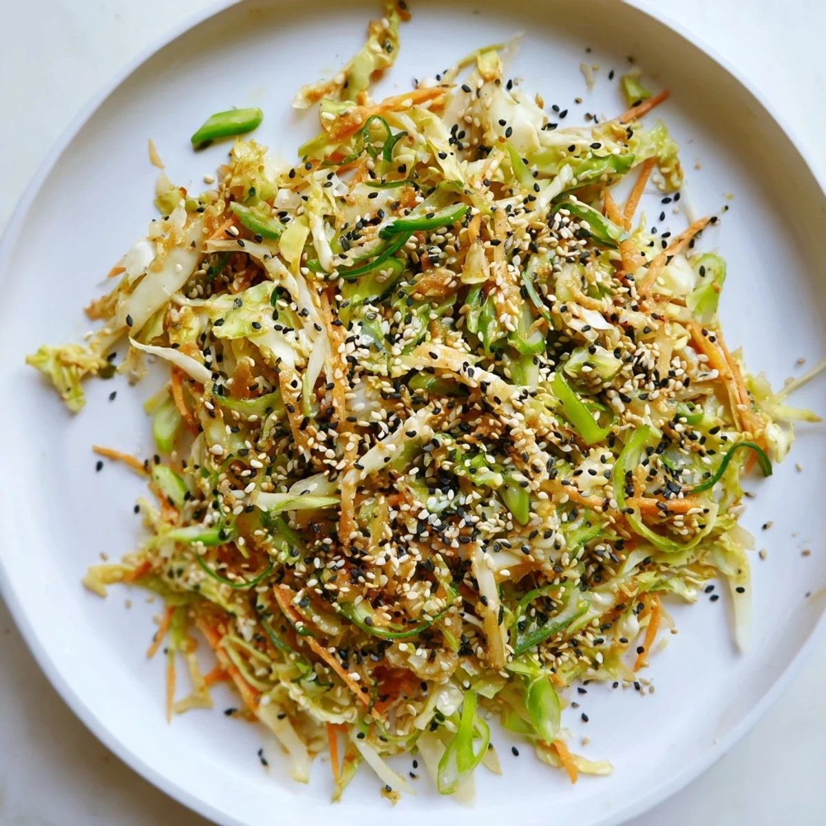 Crunchy Cabbage Core Slaw Salad bursting with fresh veggies and a savory sesame dressing.