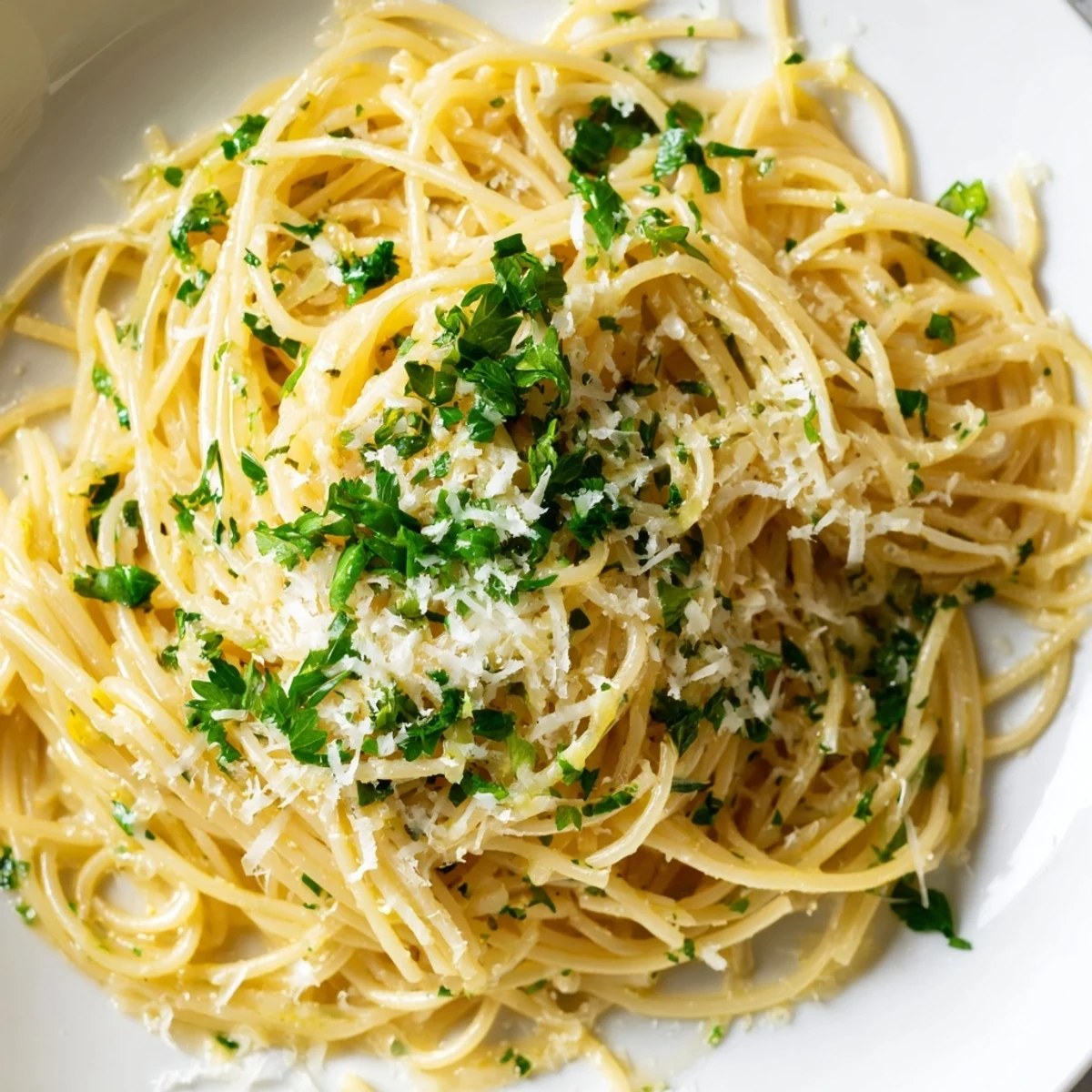 Close-up of freshly made Lemon Capellini, perfectly coated in lemon butter sauce and topped with herbs.