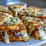 Blooming Quesadilla Ring served on a platter with bowls of salsa, sour cream, and fresh cilantro, a vibrant vegetarian party appetizer.  