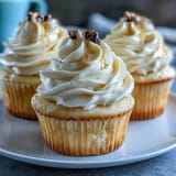 Deliciously decorated graduation cupcakes show edible black and gold fondant caps.