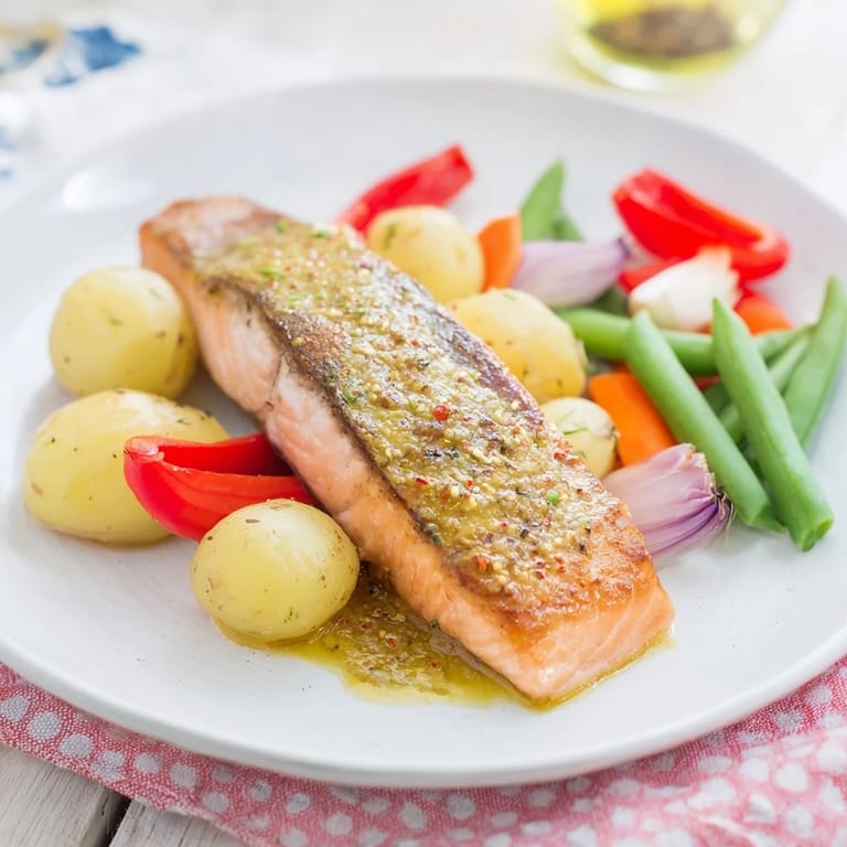 Vibrant image of One-Tray Baked Salmon, featuring flaky salmon fillets with a glossy honey mustard glaze.