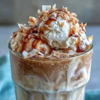Creamy coconut cold brew float topped with melting vanilla bean ice cream.